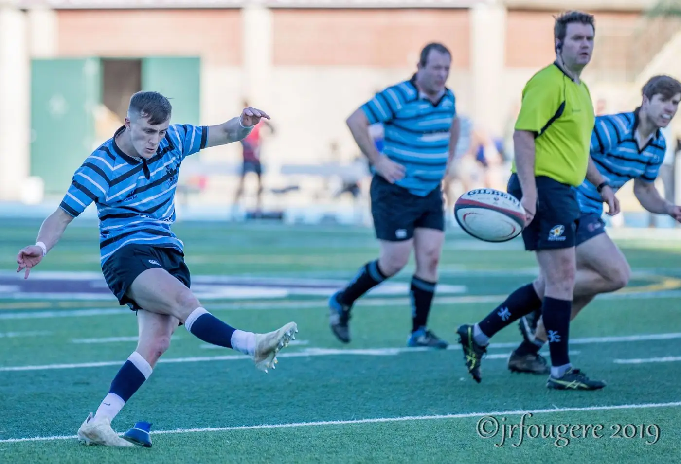 A Tars fly-half striking a kick