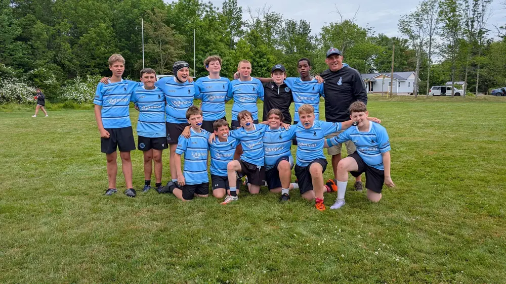 A Tars youth squad with their coach