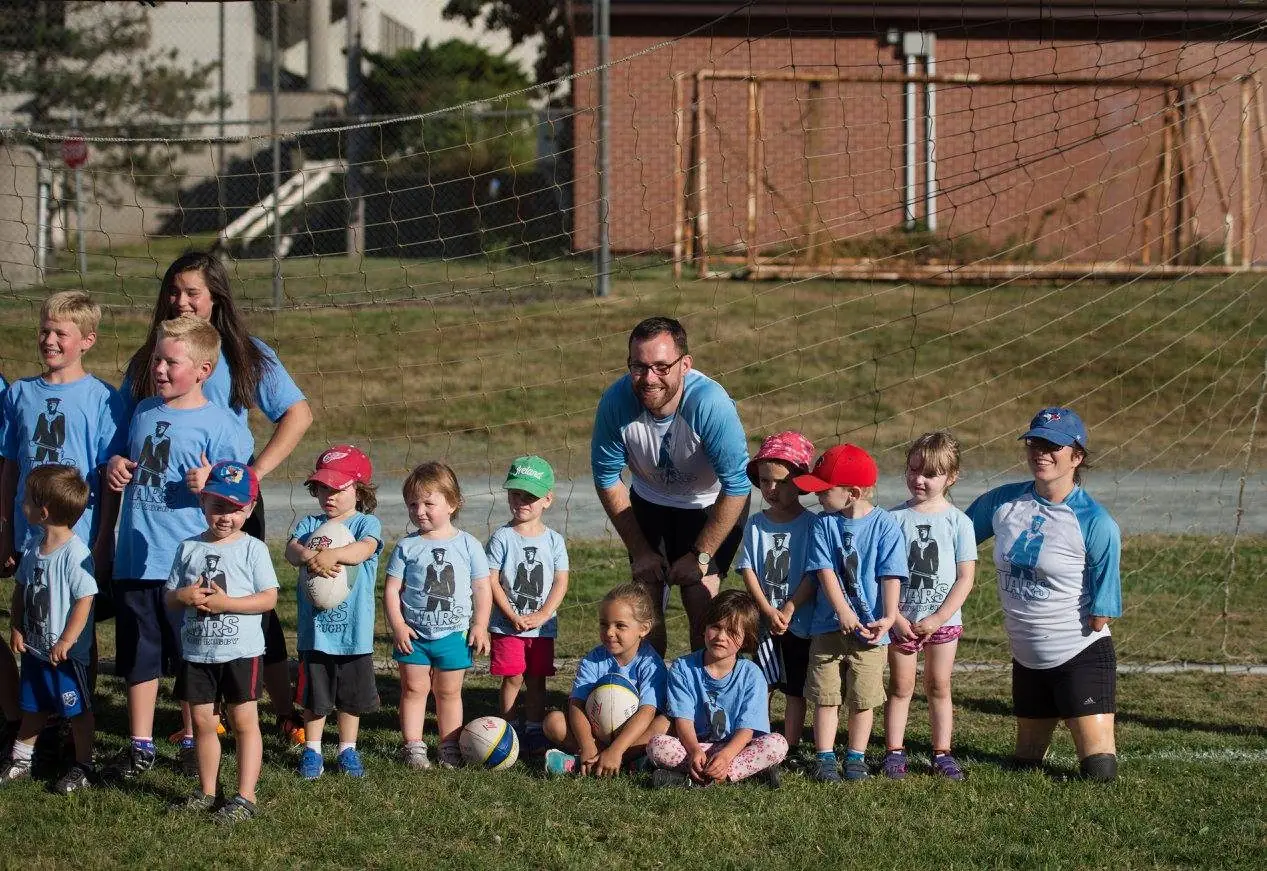 Mini rugby players and coaches at Graves-Oakley
