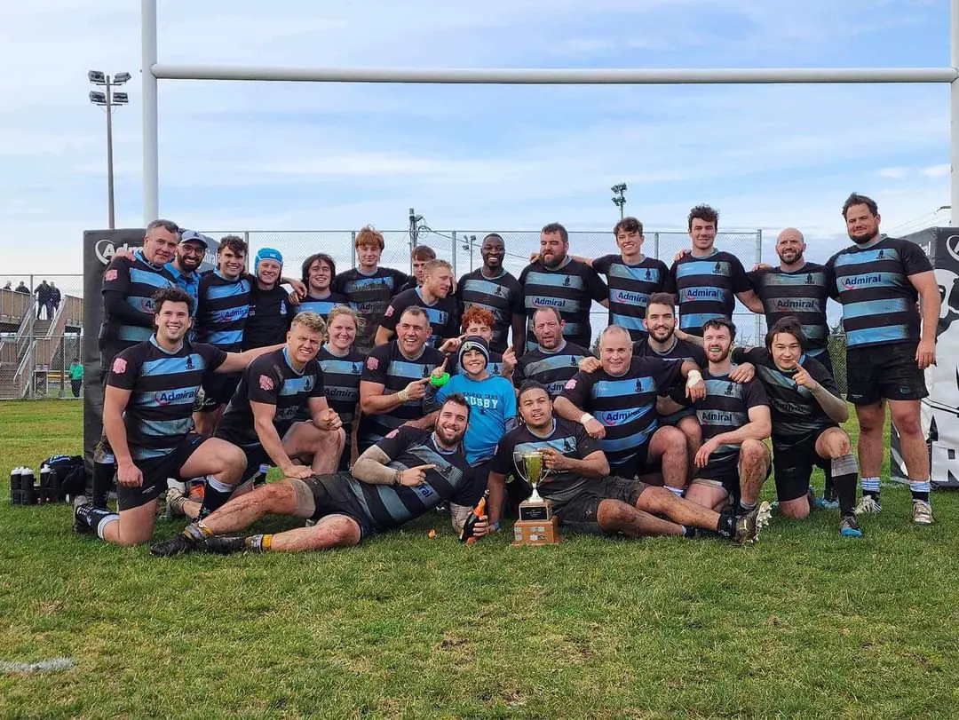 A Tars squad celebrating with the cup